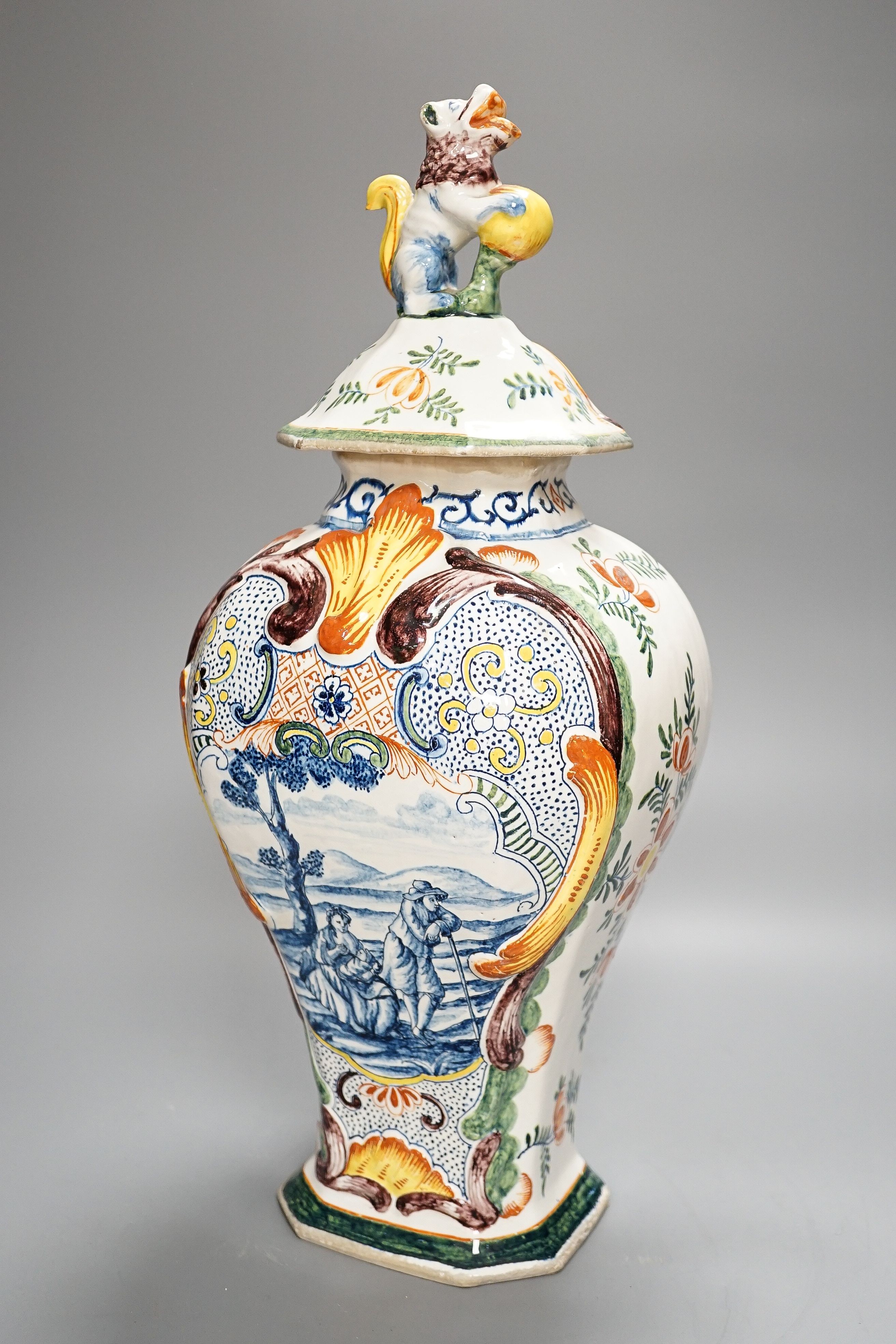 A large 19th century Delft polychrome vase and cover, 46cm, some damage